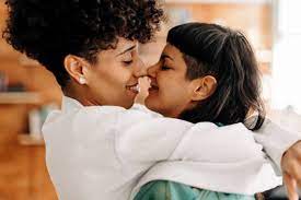 lesbian couple smiling